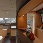 Cozy sailboat cabin featuring new cushions, LED lighting, and efficient storage from recent sailboat interiors renovations.